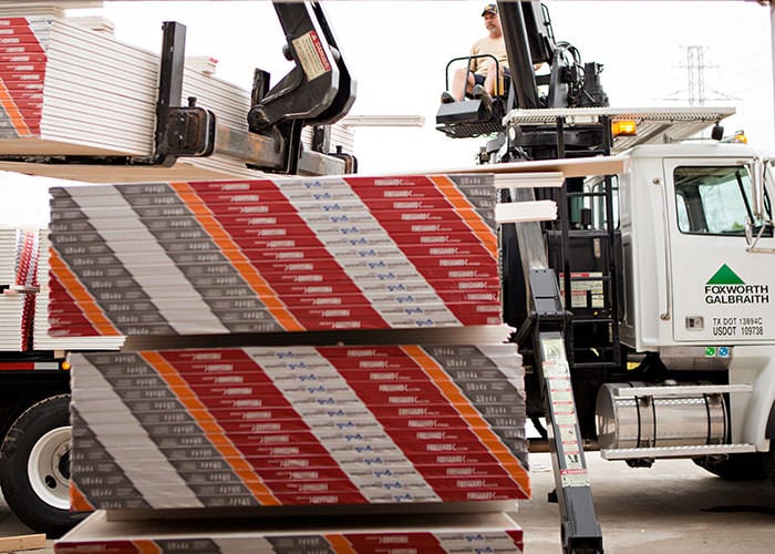 Drywall Unloading Off Truck at Job Site